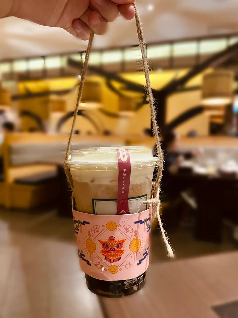 Signature bubble tea with festive sleeve